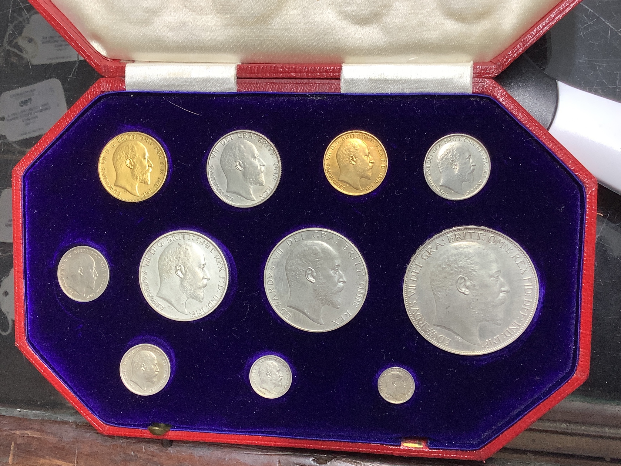 A cased Edward VII eleven-coin specimen set, matt surface, 1902, full gold sovereign through to Maundy 1d, hairlines otherwise near FDC